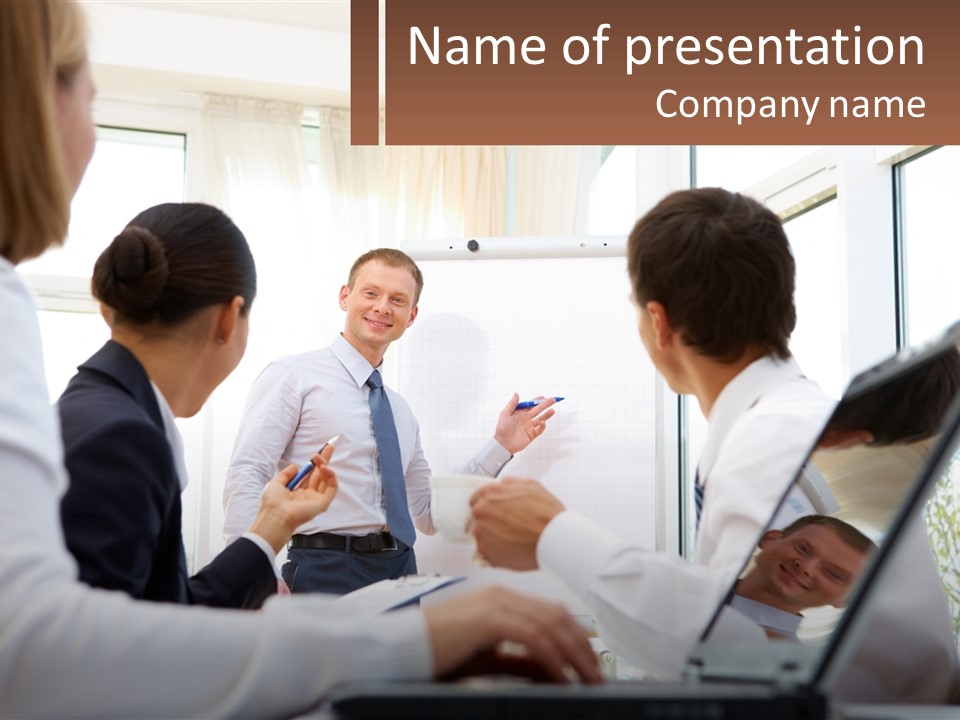 A Group Of People Standing Around A Laptop Computer PowerPoint Template