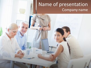 A Group Of People Sitting Around A Table PowerPoint Template