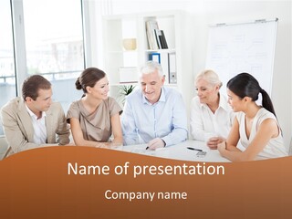 A Group Of People Sitting Around A Table PowerPoint Template