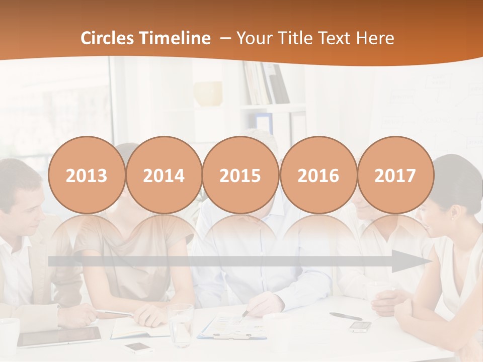 A Group Of People Sitting Around A Table PowerPoint Template
