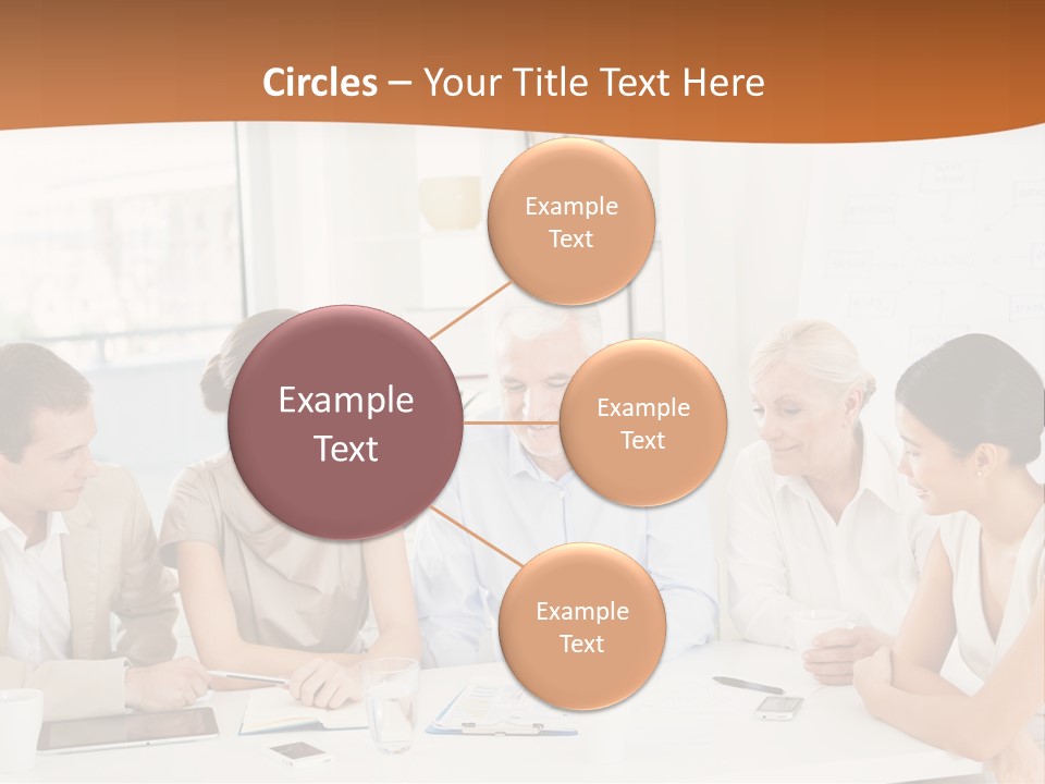 A Group Of People Sitting Around A Table PowerPoint Template