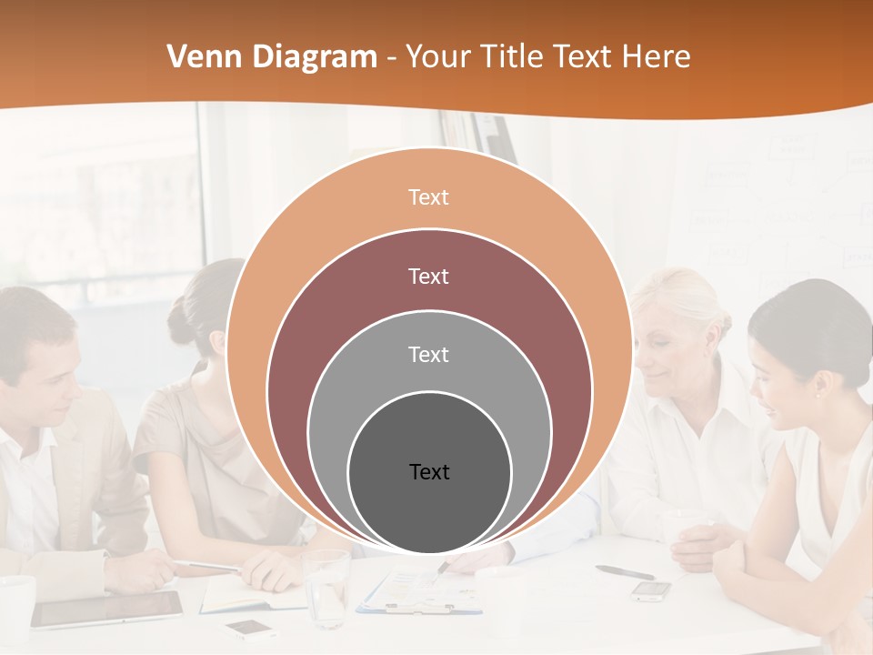 A Group Of People Sitting Around A Table PowerPoint Template