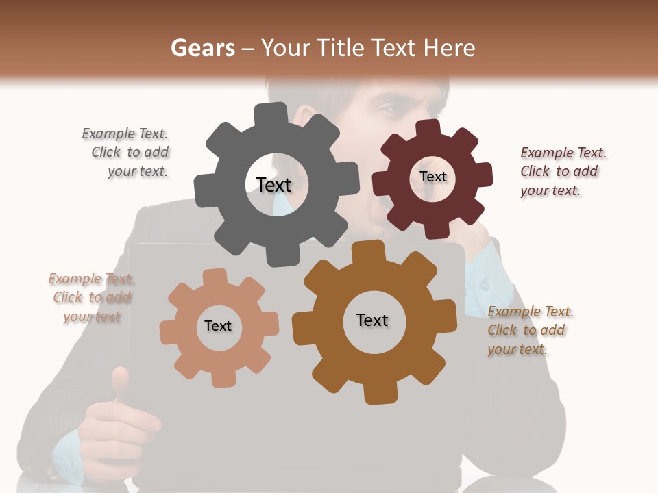 A Man In A Suit Is Using A Laptop PowerPoint Template