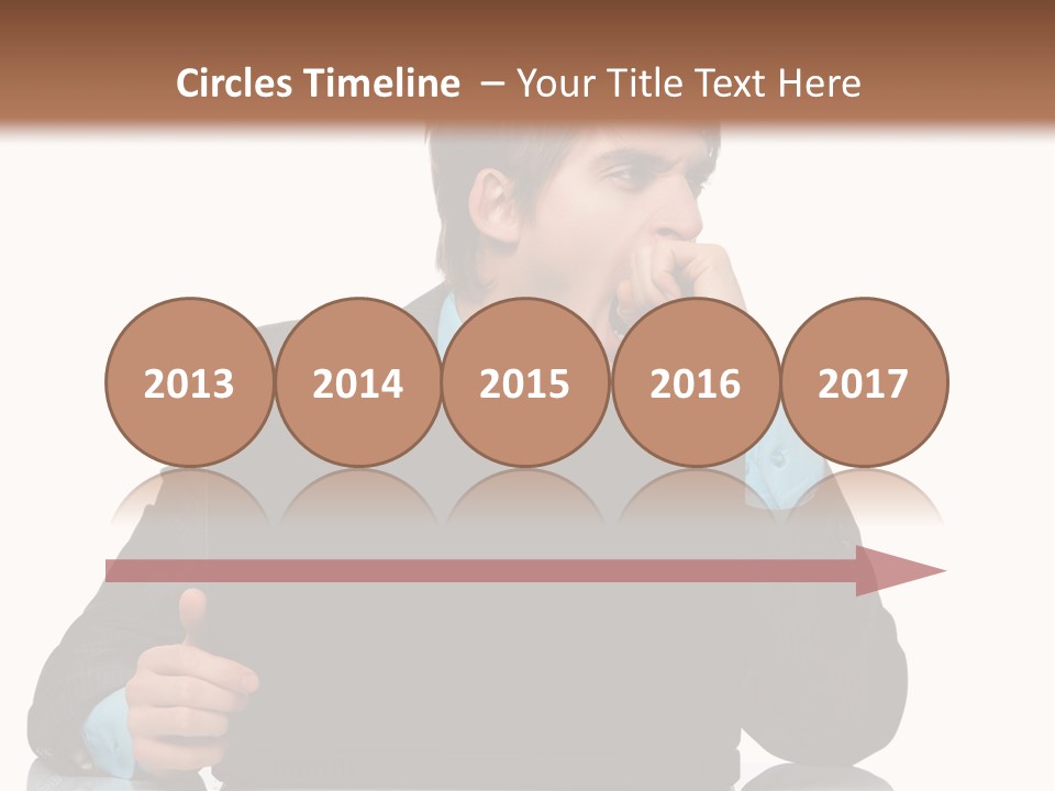 A Man In A Suit Is Using A Laptop PowerPoint Template