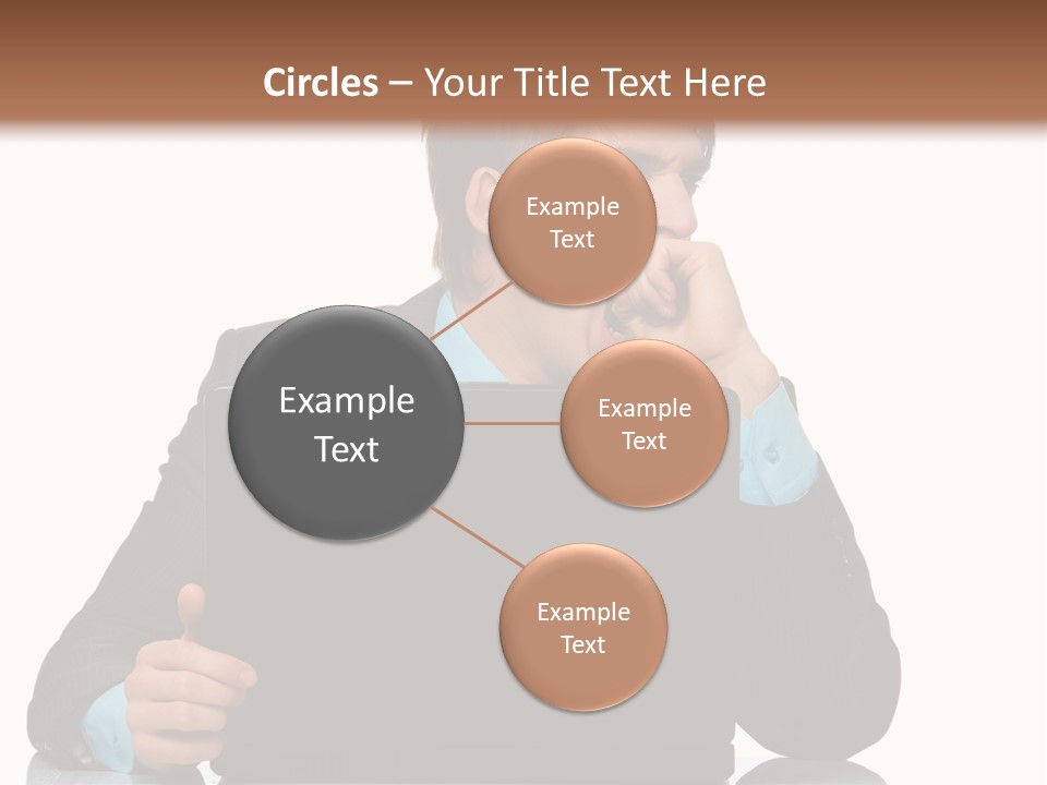 A Man In A Suit Is Using A Laptop PowerPoint Template