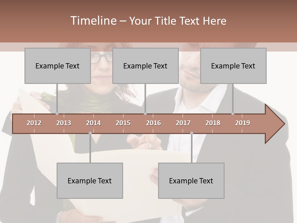 A Man And Woman Looking At A Piece Of Paper PowerPoint Template