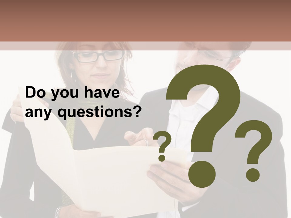 A Man And Woman Looking At A Piece Of Paper PowerPoint Template