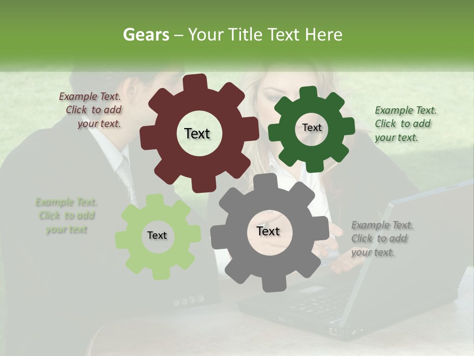 A Man And Woman Sitting At A Table Looking At A Laptop PowerPoint Template