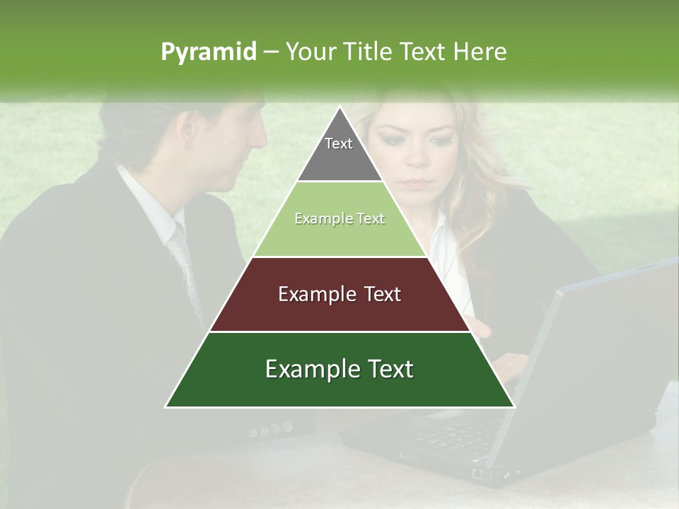 A Man And Woman Sitting At A Table Looking At A Laptop PowerPoint Template