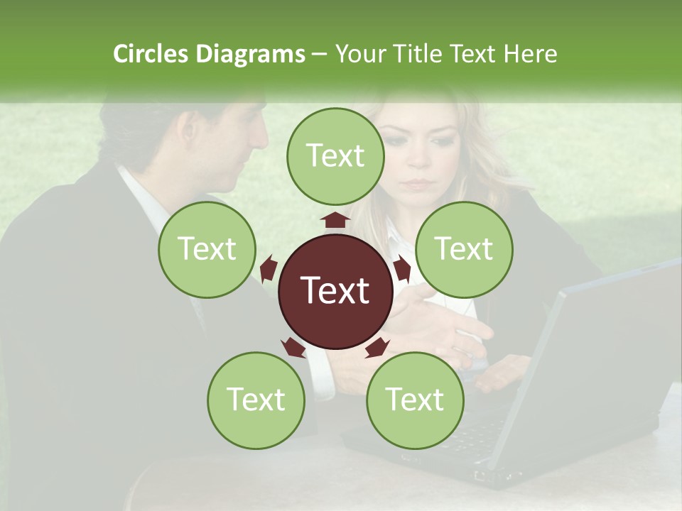 A Man And Woman Sitting At A Table Looking At A Laptop PowerPoint Template