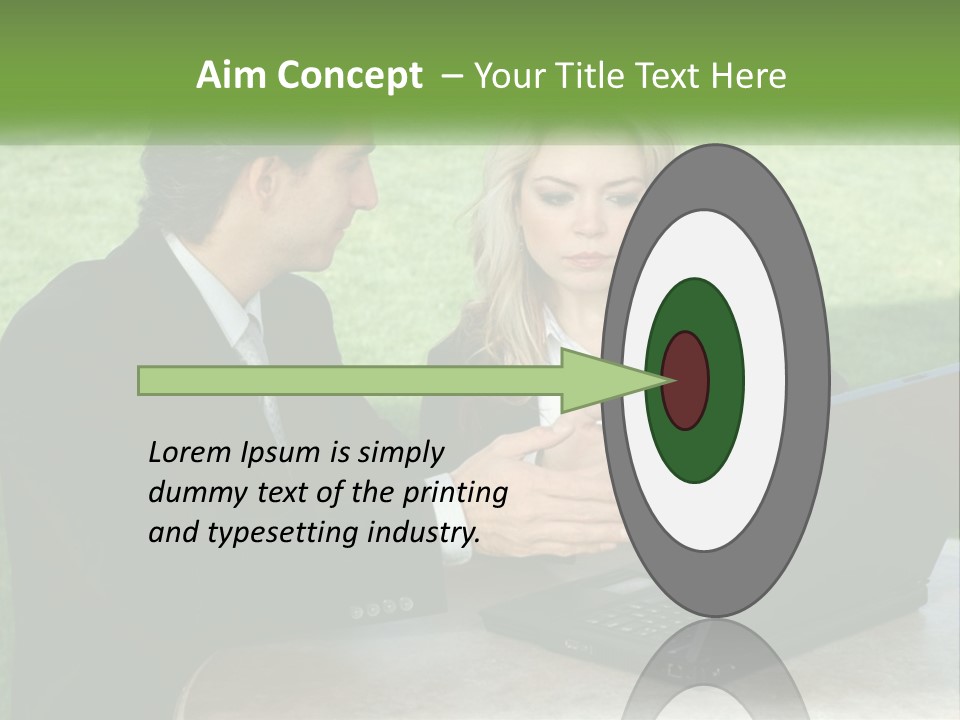 A Man And Woman Sitting At A Table Looking At A Laptop PowerPoint Template