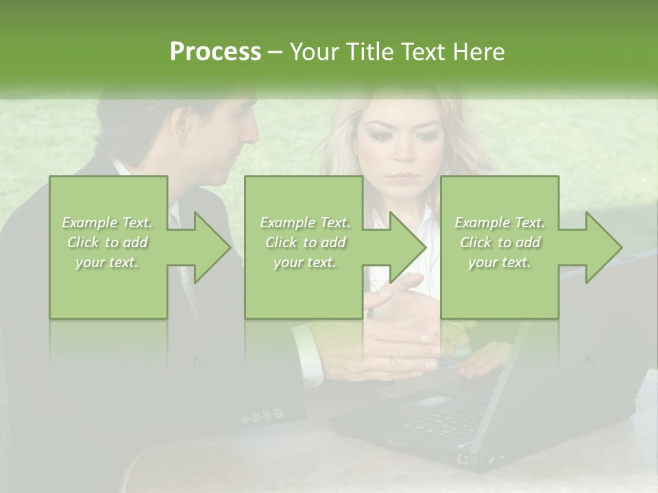 A Man And Woman Sitting At A Table Looking At A Laptop PowerPoint Template
