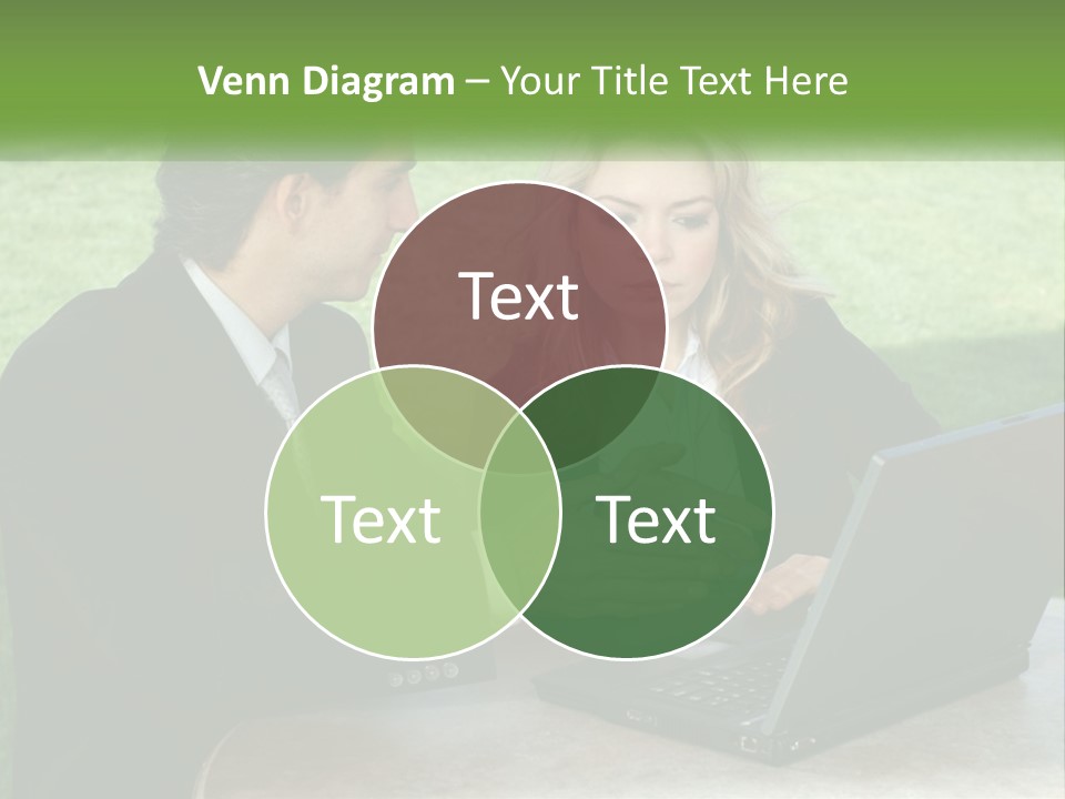 A Man And Woman Sitting At A Table Looking At A Laptop PowerPoint Template
