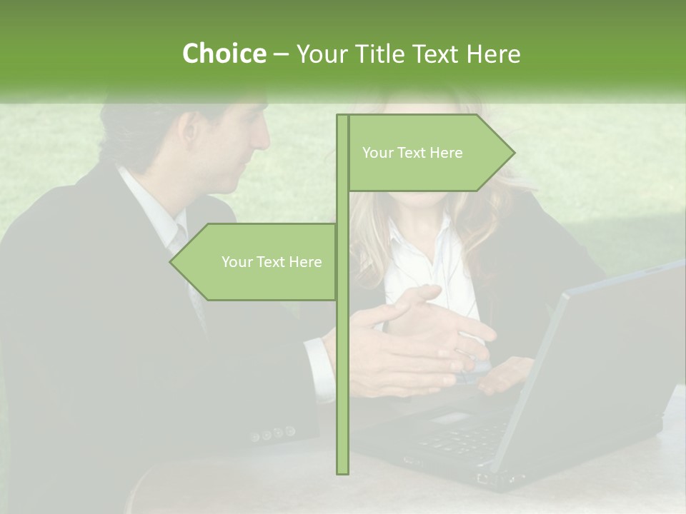 A Man And Woman Sitting At A Table Looking At A Laptop PowerPoint Template