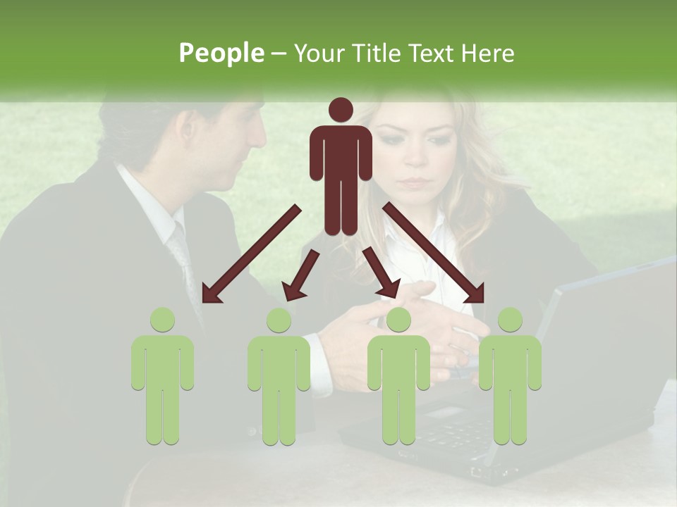 A Man And Woman Sitting At A Table Looking At A Laptop PowerPoint Template