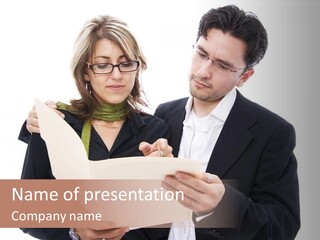 A Man And Woman Looking At A Piece Of Paper PowerPoint Template