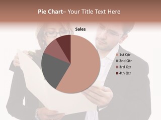 A Man And Woman Looking At A Piece Of Paper PowerPoint Template