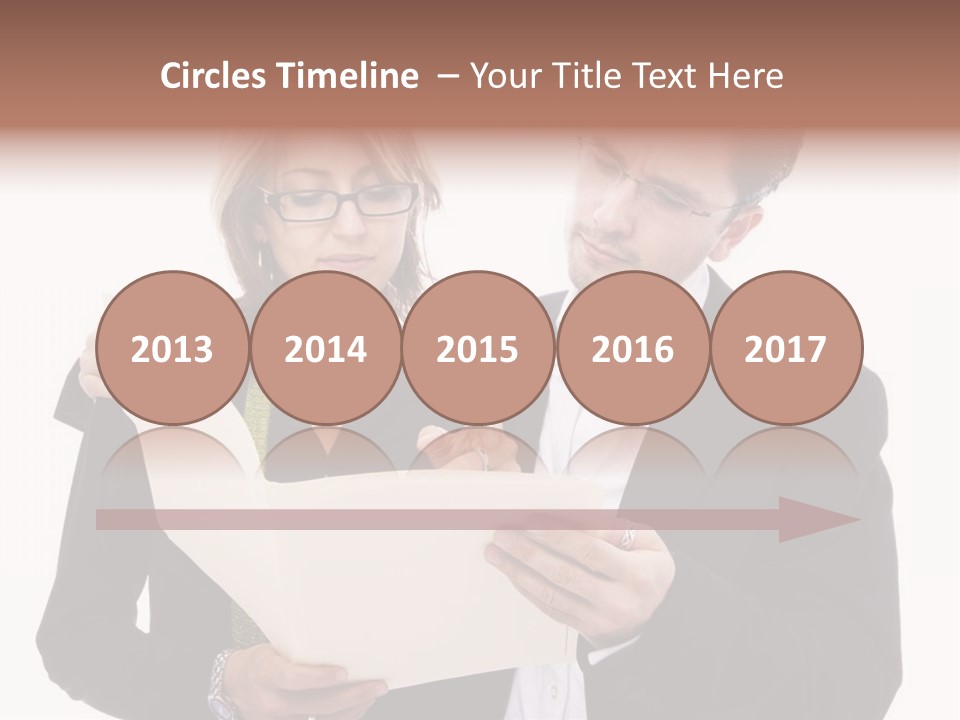 A Man And Woman Looking At A Piece Of Paper PowerPoint Template