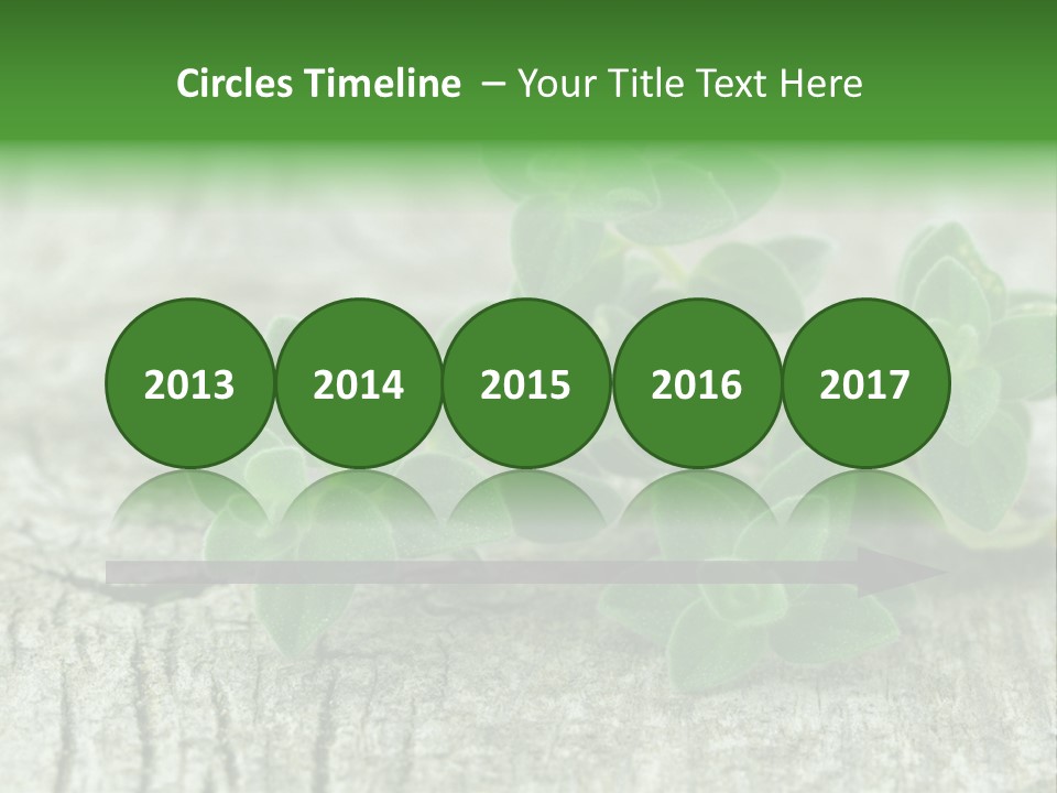 A Bunch Of Green Leaves Sitting On Top Of A Wooden Table PowerPoint Template