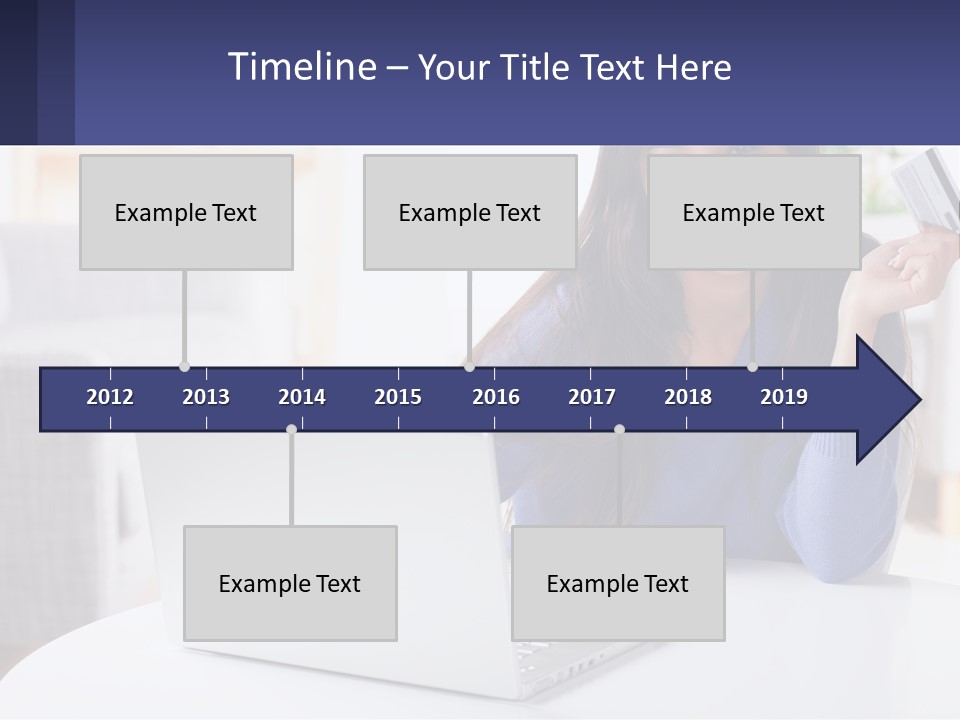 A Woman Sitting At A Table With A Laptop And A Credit Card PowerPoint Template