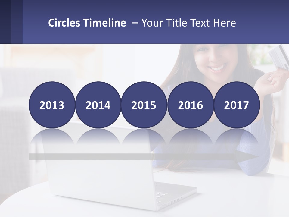 A Woman Sitting At A Table With A Laptop And A Credit Card PowerPoint Template