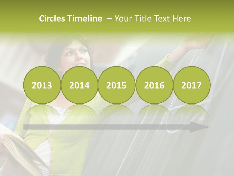 A Woman Writing On A Blackboard In A Classroom PowerPoint Template