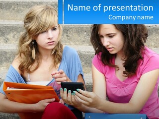 Two Young Women Sitting On Steps Looking At A Tablet PowerPoint Template