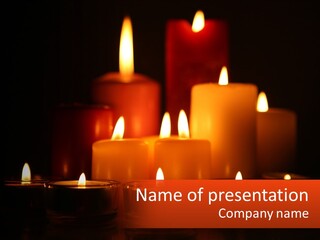 A Group Of Lit Candles On A Table PowerPoint Template