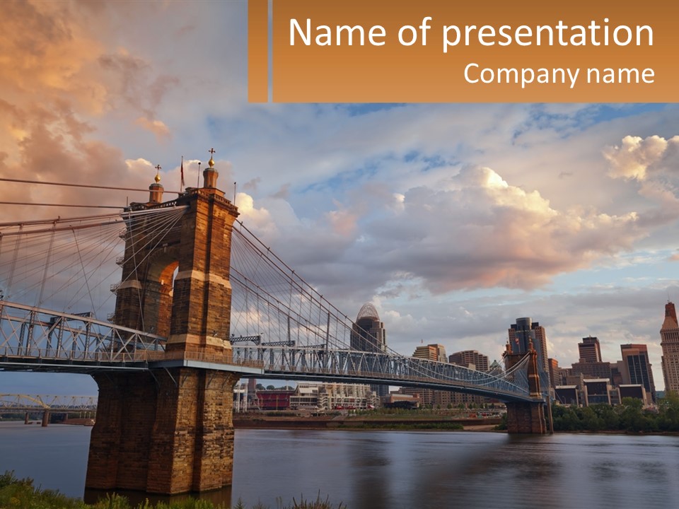 A Bridge Over A Body Of Water With A City In The Background PowerPoint Template