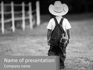 A Little Boy Wearing A Cowboy Hat And Overalls PowerPoint Template