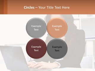 A Woman Sitting At A Desk With A Laptop PowerPoint Template