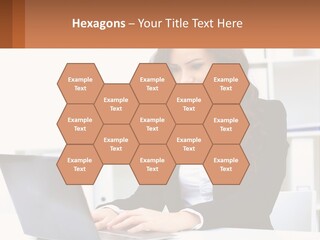 A Woman Sitting At A Desk With A Laptop PowerPoint Template