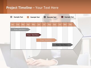 A Woman Sitting At A Desk With A Laptop PowerPoint Template
