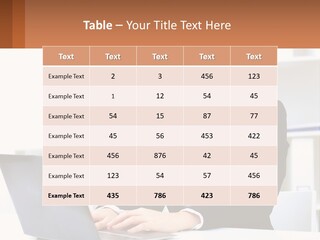 A Woman Sitting At A Desk With A Laptop PowerPoint Template