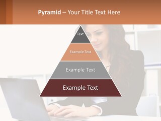 A Woman Sitting At A Desk With A Laptop PowerPoint Template