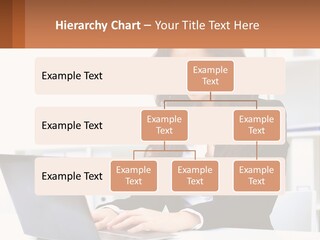 A Woman Sitting At A Desk With A Laptop PowerPoint Template