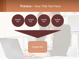 A Woman Sitting At A Desk With A Laptop PowerPoint Template