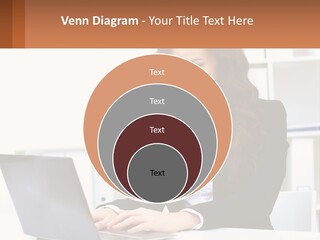 A Woman Sitting At A Desk With A Laptop PowerPoint Template