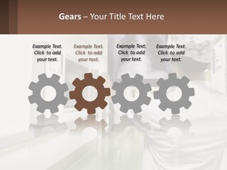 A Woman In A White Lab Coat Is Looking At A X - Ray PowerPoint Template