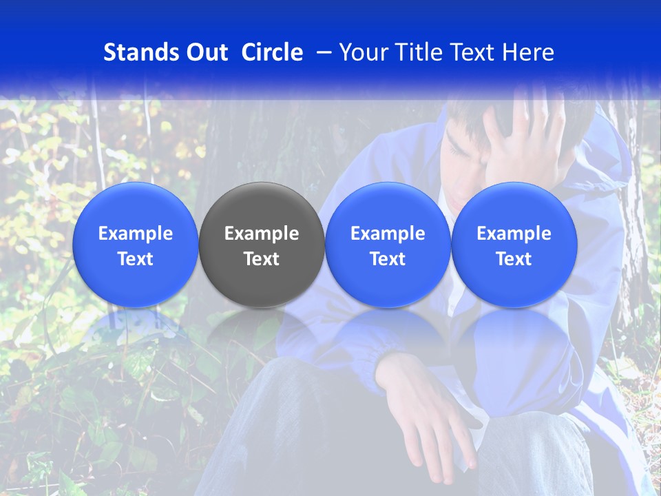 A Man In A Blue Jacket Sitting Next To A Tree PowerPoint Template