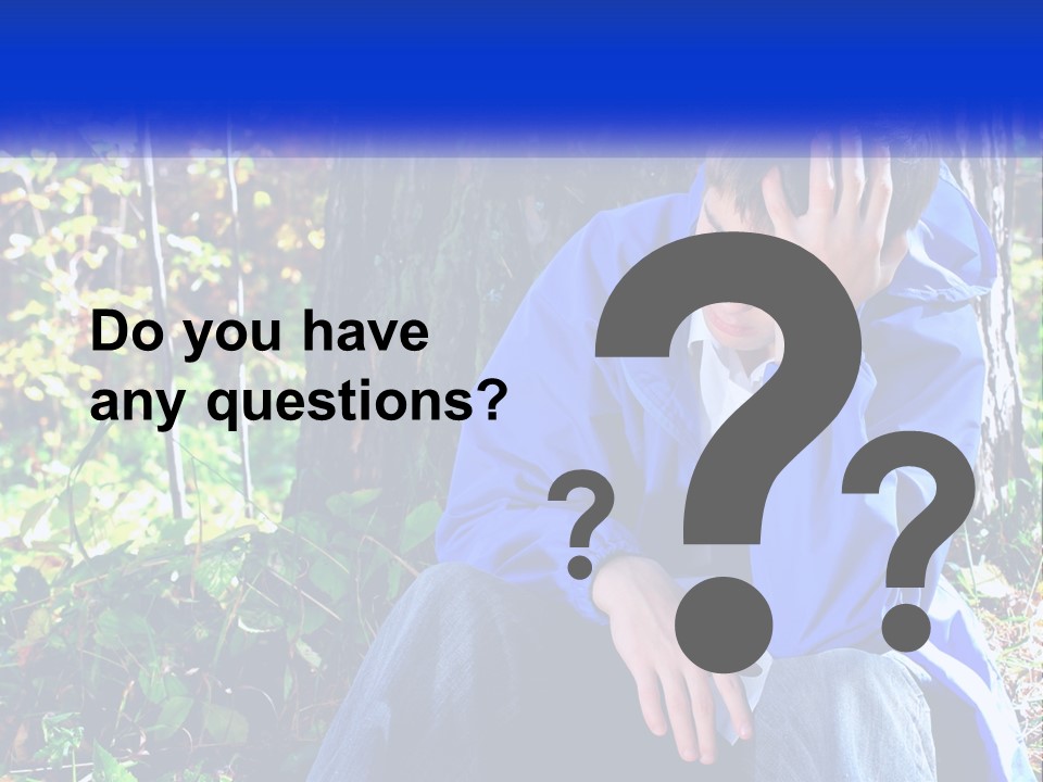 A Man In A Blue Jacket Sitting Next To A Tree PowerPoint Template