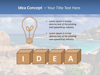 A Rocky Beach With Blue Water And White Clouds PowerPoint Template