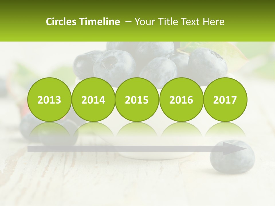 A White Bowl Filled With Blueberries On Top Of A Wooden Table PowerPoint Template