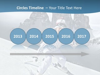 A Woman Skiing Down A Mountain With Mountains In The Background PowerPoint Template