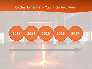 A Man Working On A Piece Of Metal In A Factory PowerPoint Template