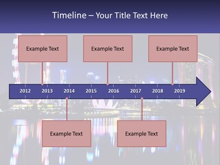 A Large Ferris Wheel In The Middle Of A City At Night PowerPoint Template