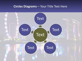 A Large Ferris Wheel In The Middle Of A City At Night PowerPoint Template