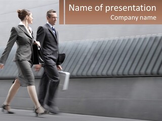 A Business Man And Woman Walking Down A Street PowerPoint Template