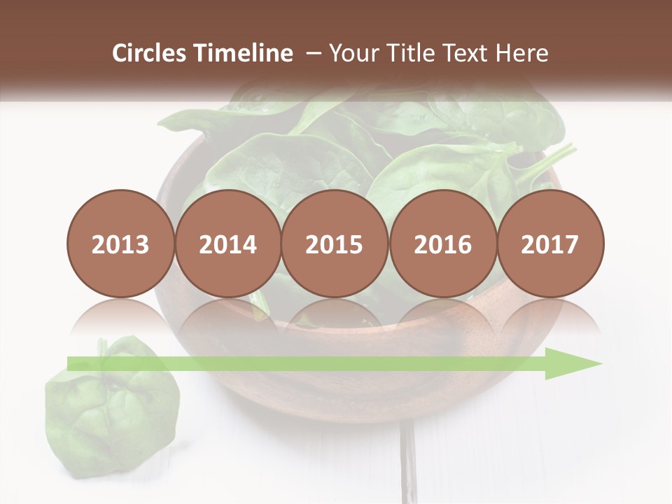 A Wooden Bowl Filled With Green Spinach Leaves PowerPoint Template