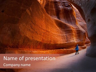 A Person Standing In The Middle Of A Canyon PowerPoint Template